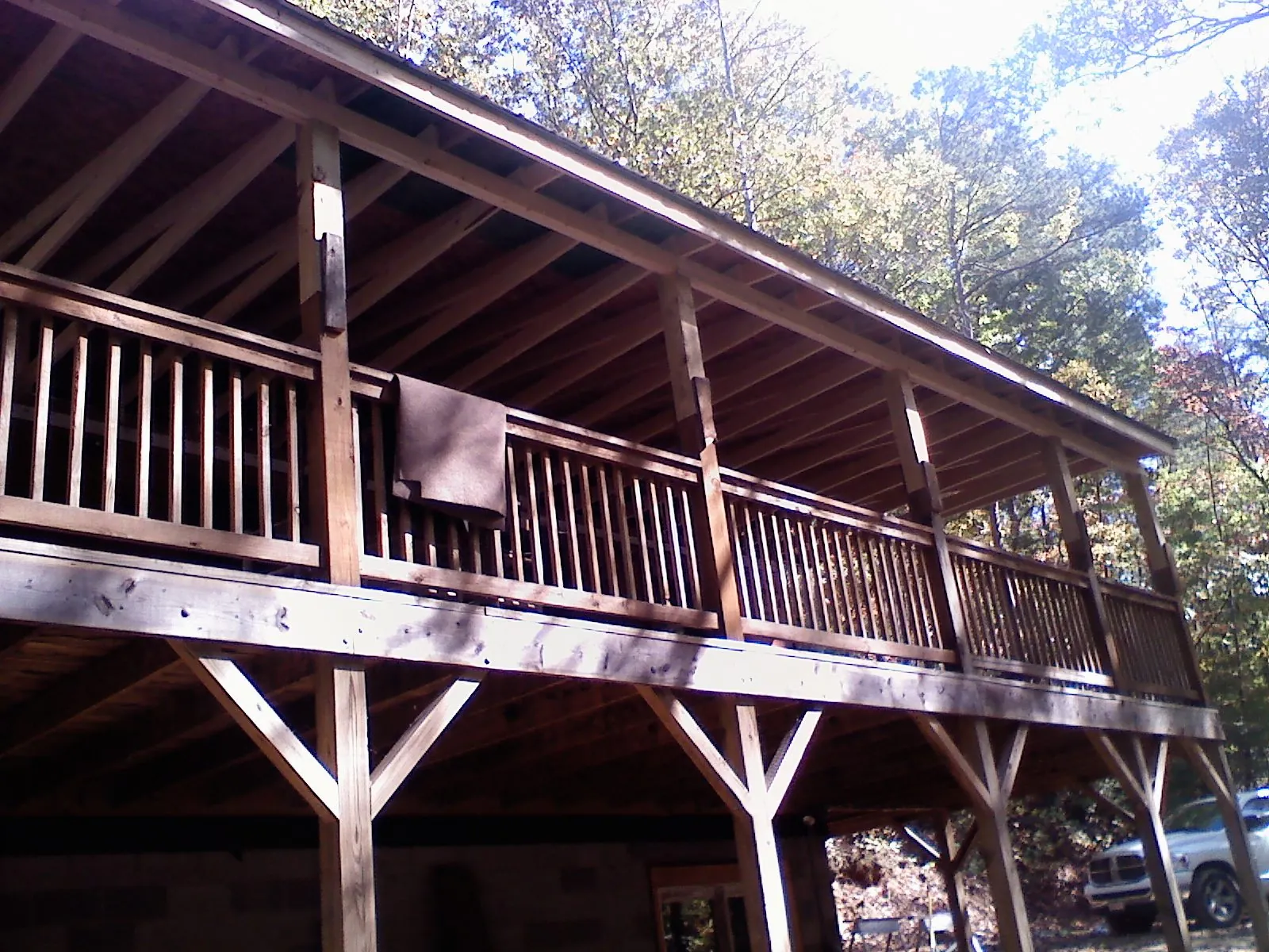 Timber framing under a new elevated porch and deck — Roof Leak Repair in Webster Springs by Roofing Brothers